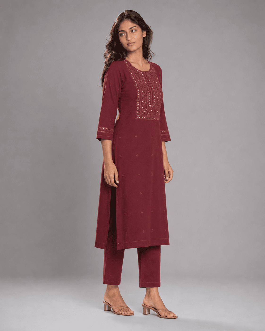 Side view - Anaya wearing a maroon embroidered kurti