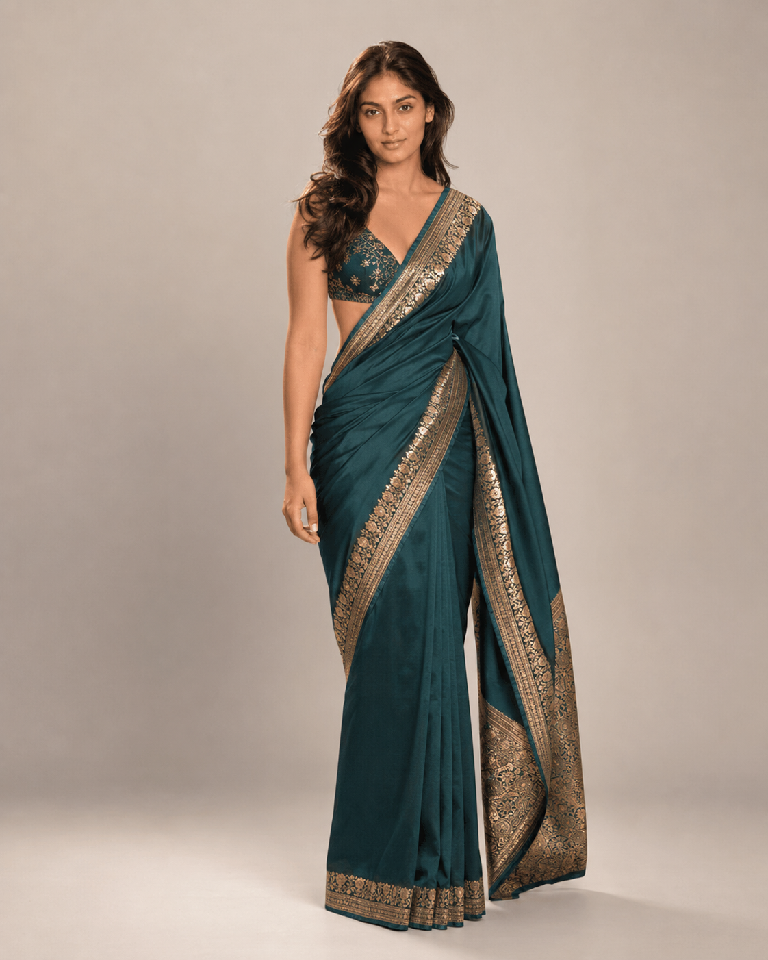 Anaya wearing a teal Banarasi silk saree