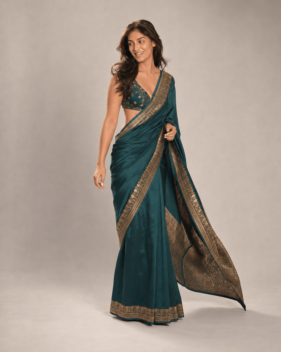 Anaya walking in the teal saree, lifestyle shot