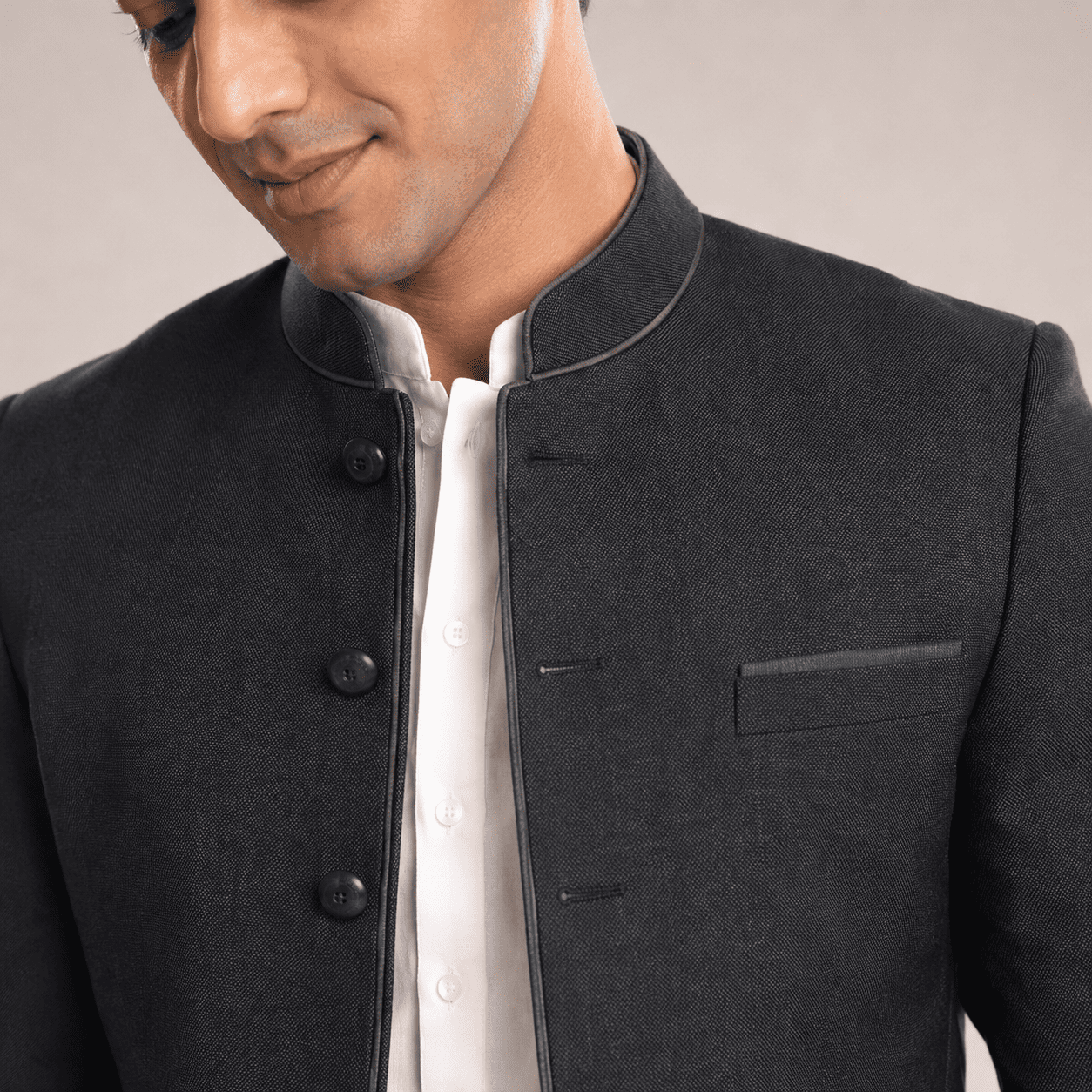 Close-up of black bandhgala fabric and collar detail