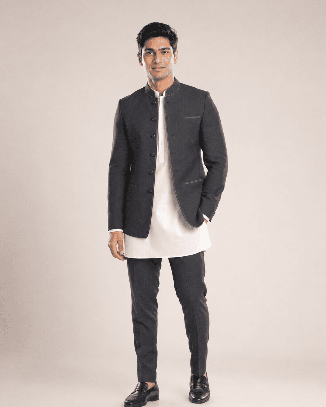 Arjun wearing a black bandhgala over a white kurta