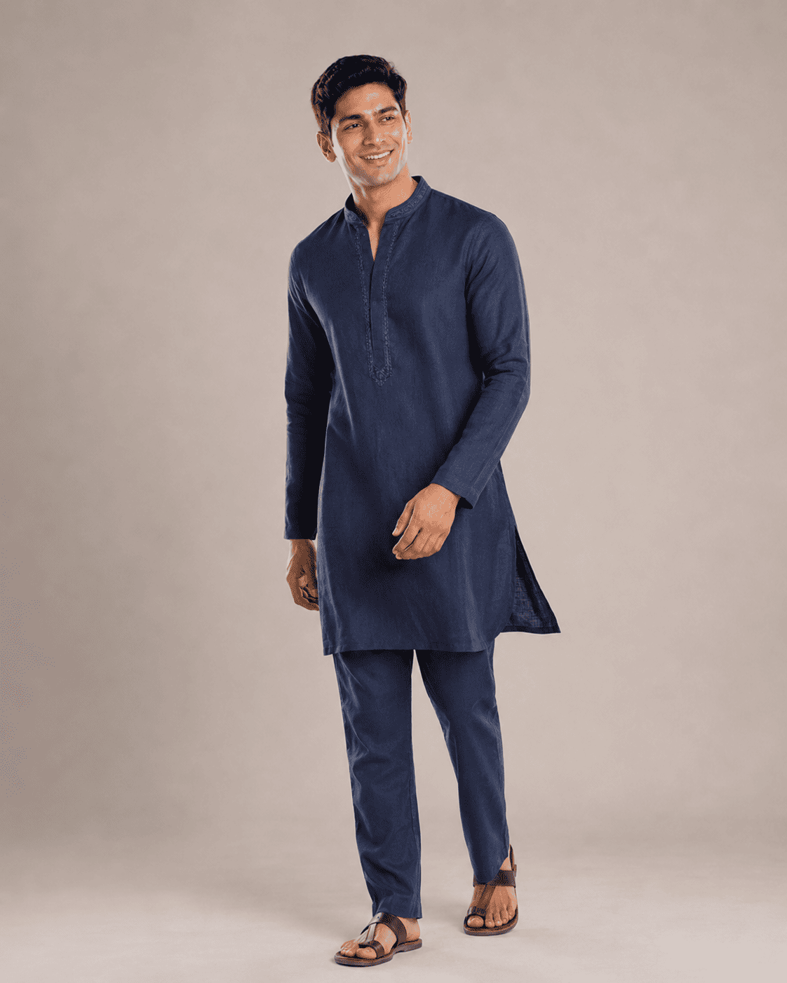 Arjun walking in the navy blue kurta, lifestyle shot